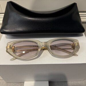 Gentle Monster Translucent Oval Sunglasses Gold Metal Detail
